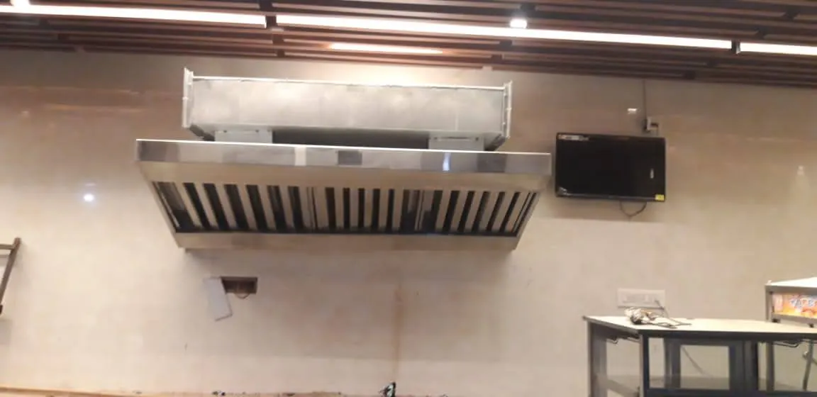 Exhaust hood and duct installed over a restaurant cooking line