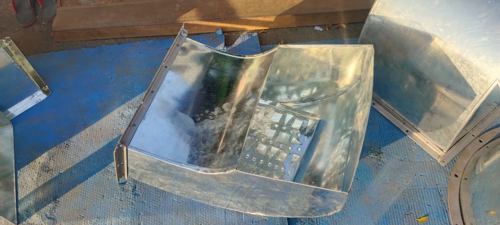 Curved sheet metal transition piece formed by hand in the workshop