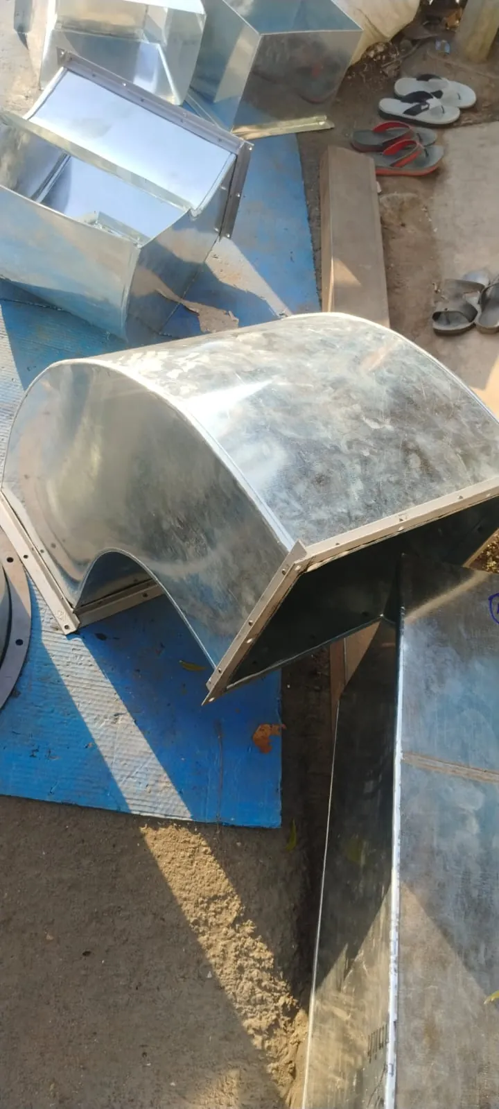 Curved duct elbow being fabricated in the workshop